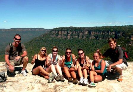 Working Holiday Makers - group shot in front of rugged hills